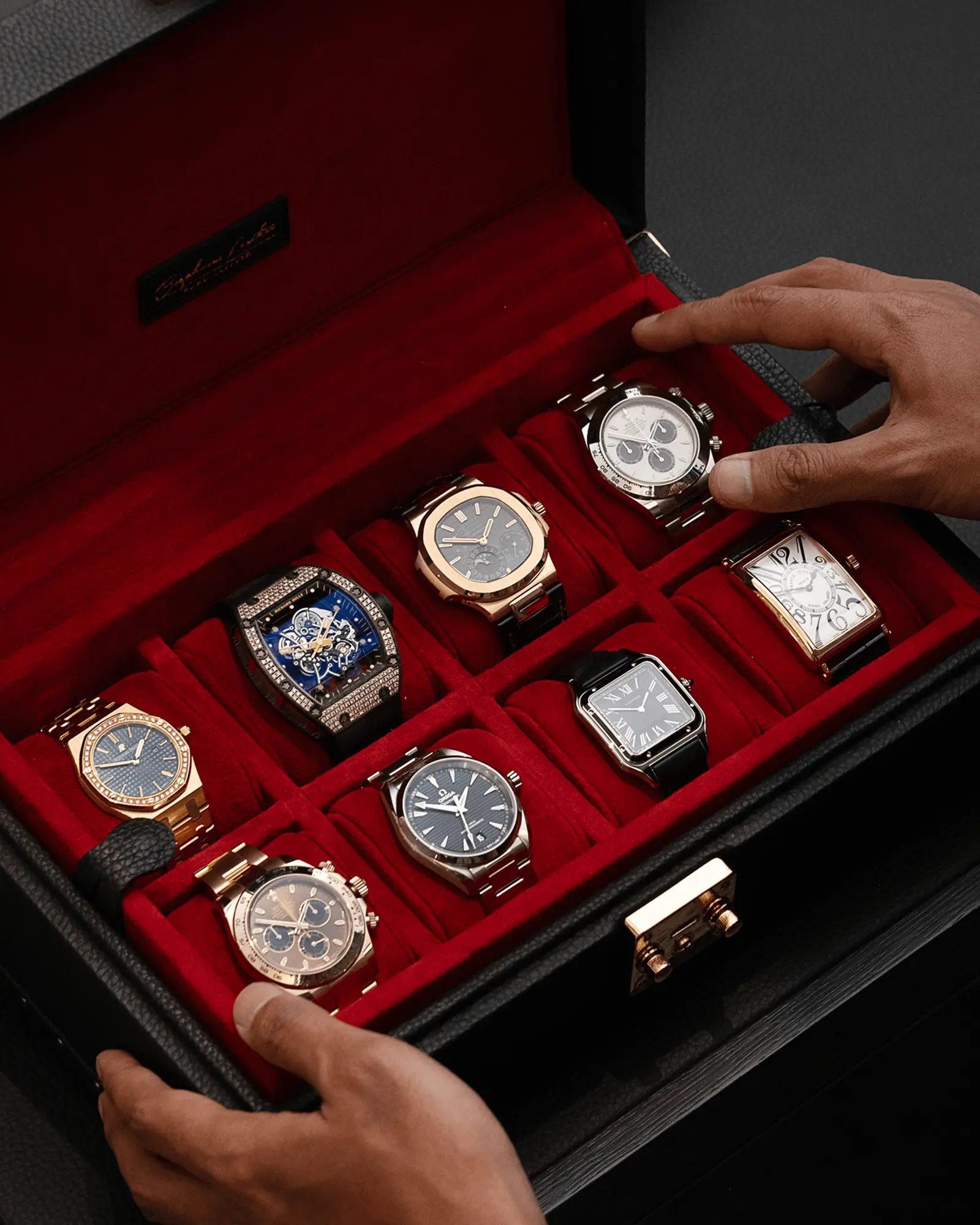 Luxehouze specialist handling a watch collection